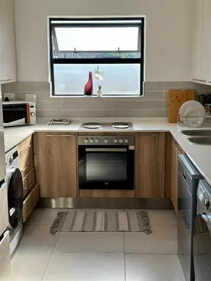 a kitchen with a stove and a window at M Luxury Home In Irene Centurion-No Blackouts in Centurion