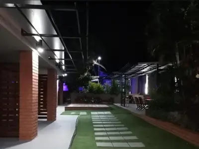 a night view of a courtyard with a house at 30 on Bergh in Louis Trichardt