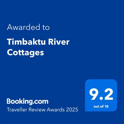 a blue screen with the text awarded to timikoku river coffees at Timbaktu River Cottages in Moheme