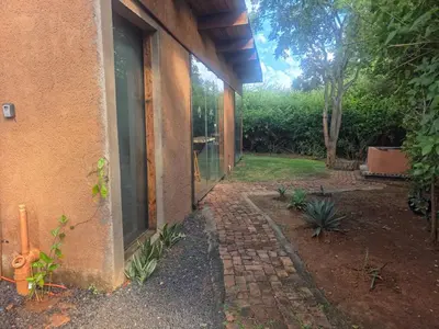 an outside view of a house with a window at Hartbees Bush Stay #1 in Hartbeespoort