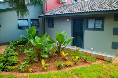 a house with a garden in front of it at Adondo-fast accommodation in Pretoria