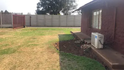 a backyard with a microwave in a yard at Home Way Studio Sleeps 2 with Garden in Springs