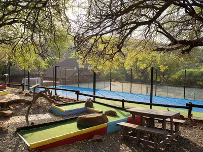 a park with a playground with a picnic table at Mabalingwe Elephant Lodge 256A in Moheme