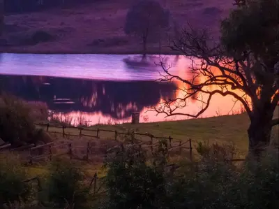 a view of a lake at night at Kinloch Lodge in Dullstroom