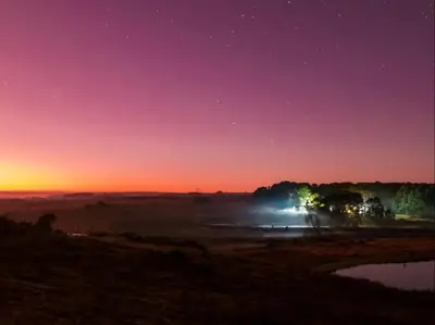 a night view of a field with the stars at Kinloch Lodge in Dullstroom