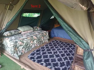 a tent with a bed and a mattress in it at Rustic Unique - Bush Glamping Retreat in Kalkheuvel