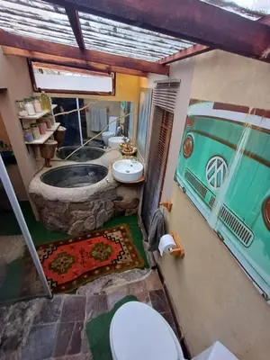 an overhead view of a bathroom with a tub and sink at Rustic Unique - Bush Glamping Retreat in Kalkheuvel