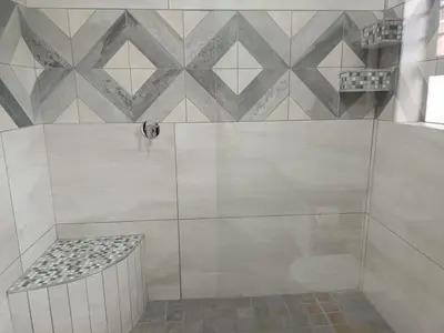 a shower with a bench in a bathroom at Sonop in Marloth Park in Marloth Park