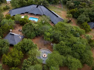 an aerial view of a house in the trees at Sable Ranch Bush Lodge in Brits