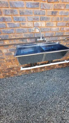 a sink on the side of a brick wall at Legaeng Cottage - Serenity in Pretoria