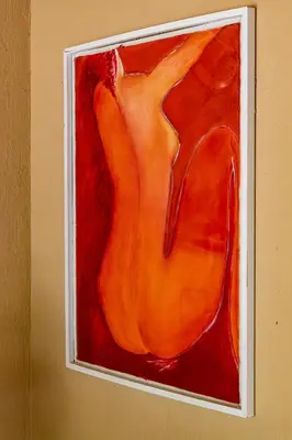 a painting of an orange object on a wall at Hoedspruit Bush Cottage in Hoedspruit