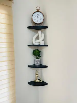 a clock and trophies on shelves in a room at Mnqobi Lifestyle Apartments in Nelspruit
