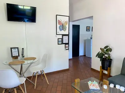 a living room with a couch and a table at The White House in Hartbeespoort