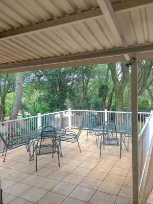 a group of chairs sitting on a patio at Alpha B Lodging in Thabazimbi