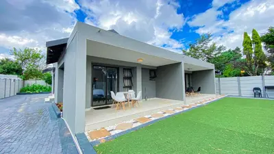 a small house with a lawn in front of it at Midrand Air B and B House in Midrand
