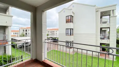 a balcony with a view of a building at Midrand Air B and B Apartment in Midrand