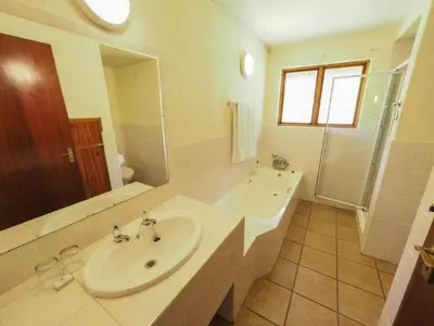 a white bathroom with a sink and a shower at Kruger Park Lodge Unit 550 With Private Pool in Hazyview
