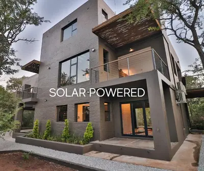 a building with a solar powered sign on it at Akasha by Kruger Nights in Marloth Park