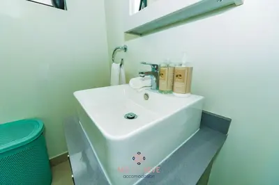 a bathroom with a white sink in a room at Nid de Rêve Accommodation in Midrand