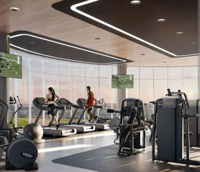 a gym with two people exercising on tread machines at Ellipse Waterfall Luxury Apartments in Midrand