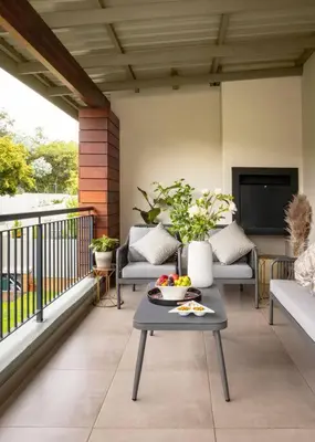 a patio with a table and chairs on a balcony at Fore's Luxurious Home in Midrand