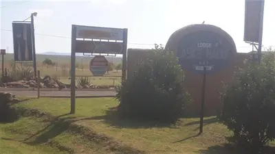 a sign for a gas station on a road at Lodge Laske Nakke in Lydenburg