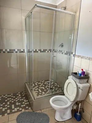 a shower stall with a toilet in a bathroom at Air bnb 204 in Midrand