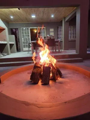 a fire pit in the middle of a patio at Kudus Crest Bush Retreat in Marloth Park