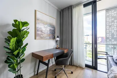 a room with a desk and a chair and a window at iNqaba @Ellipse Waterfall in Midrand