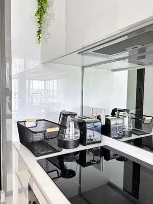 a kitchen with a counter top with a mirror at Executive Suite at Ellipse in Waterfall Midrand in Midrand