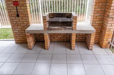 a stone bench sitting on a brick wall at Ingwe House in Marloth Park