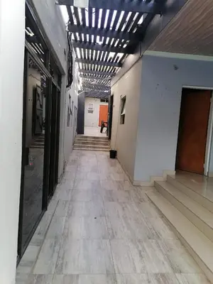 an empty hallway in a building with a ceiling at Tshilidzi Guest House in Pretoria