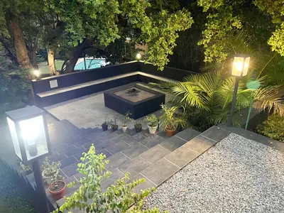 an overhead view of a patio with plants and a fire pit at Afrique134 Baobab Tree Private Family Garden Suite in Pretoria