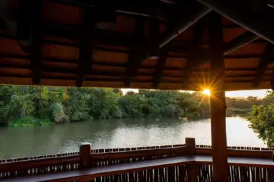 a view of a river from the porch of a cabin at Kruger Park Lodge Unit No. 265 in Hazyview