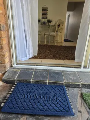 a welcome mat on the door of a house at Ocean Vibe in Pretoria