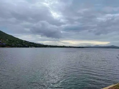 a large body of water under a cloudy sky at Sun Room (Studio) on the edge of the Harties dam. in Hartbeespoort