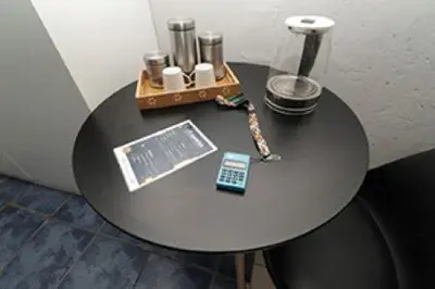 a black table with a lamp on top of it at Quintax Guest House in Pretoria