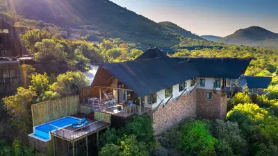 an aerial view of a house with a swimming pool at Babohi at Qwabi Private Game Reserve by NEWMARK in Bela-Bela