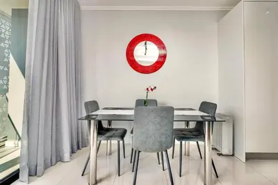 a dining room with a table and chairs at Keza Cove at Waterfall Ellipse in Midrand